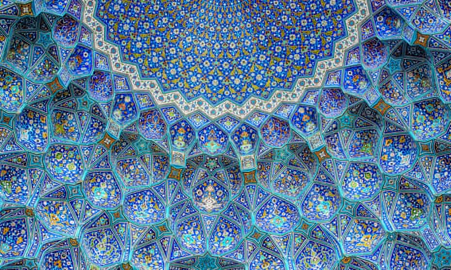 An image of the beautiful blue ceiling of the Shah Mosque in Isfahan, Iran.